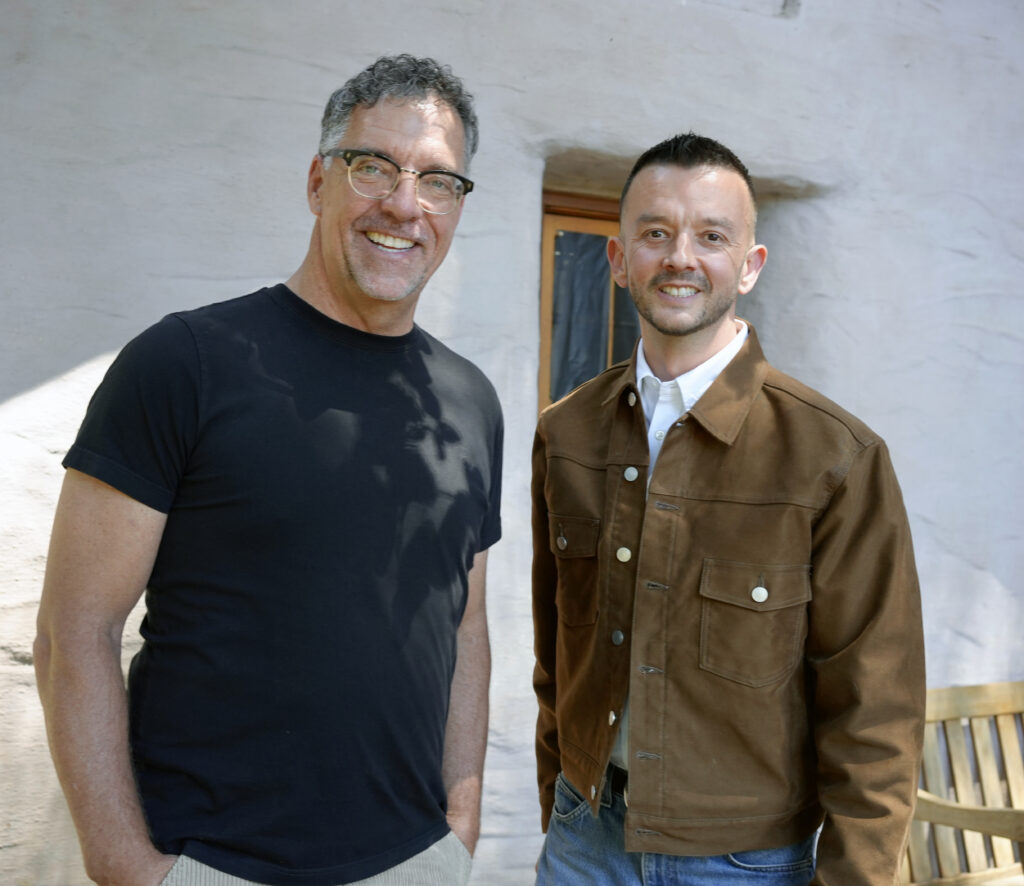 Mike Ingrasci and Drew Horning standing outside of the Hoffman Podcast Studio at Santa Sabina