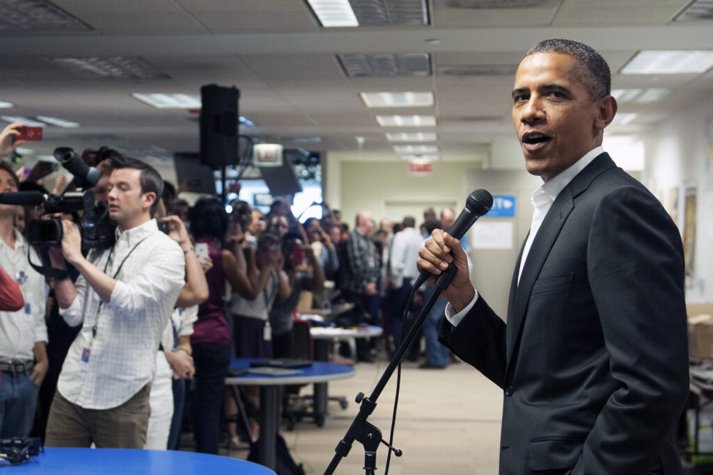 Mike videoing the crowd on the left with President Obama speaking on the right