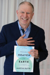 Martin Rutte holding his book Heaven on Earth Hoffman Podcast